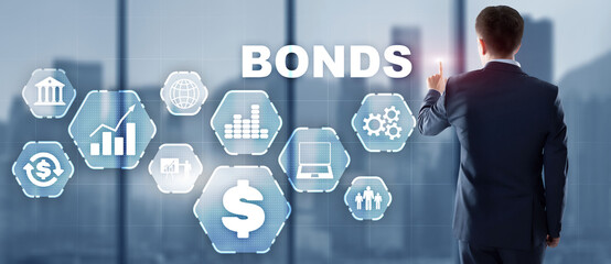 Corporate Bonds concept. Man presses his finger on the inscription Bonds.