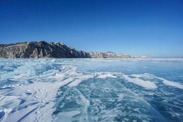 crack blue beautiful ice crystal sheets in Baikal lake during winter season