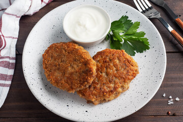 Buckwheat cutlets with cheese and parsley on a plate. Healthy diet food