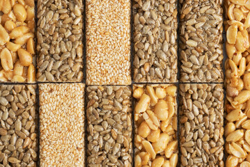 Oriental sweetness of brittle, Kozinaki in sugar glazed peanuts, sunflower seeds and sesame seeds....