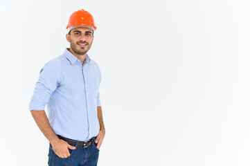 Portrait of young construction engineer wear orange hardhat, standing on white background with copy space.
