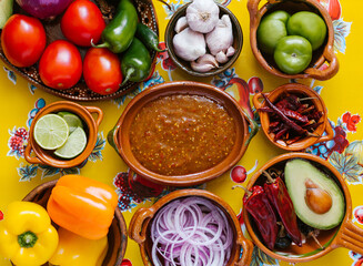 mexican salsa spicy sauce and ingredients on a table kitchen in Mexico city, Top view copy space.