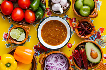 mexican salsa spicy sauce and ingredients on a table kitchen in Mexico city, Top view copy space.