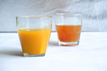 herbal drinks of tamarind and turmeric herbs in a glass in white background