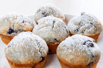 Homemade freshly baked muffins with berries  on the plate