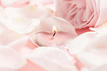 Pink roses and heart-shaped candles