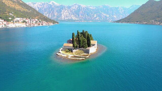 Aerial view of the Our Lady of the Rocks church and Island of Sveti Djordje in the Kotor Bay near Perast town, Montenegro. 4K video