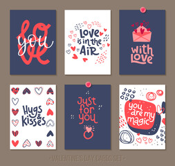Set Valentine's Day greeting cards with lettering and decorative hand drawn love elements.