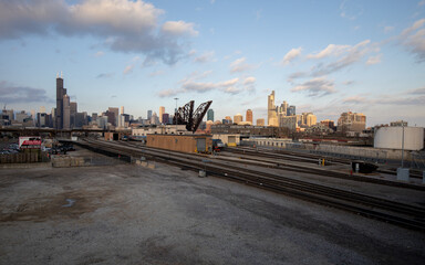 Chicago, Illinois, USA - December 23 2020: Chicago skyline with St. Charles Air Line Bridge. View from Amtrak Chicago Car Yard. 