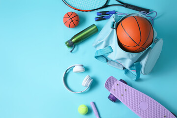 Set of sports equipment on color background