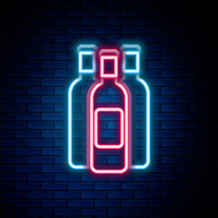 Glowing neon line Bottles of wine icon isolated on brick wall background. Colorful outline concept. Vector.