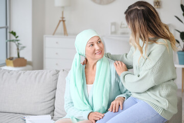 Fototapeta premium Daughter visiting her mother after chemotherapy at home