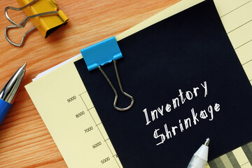  Financial concept meaning Inventory Shrinkage with sign on the sheet.
