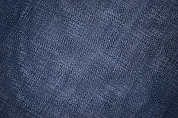 Fototapeta na wymiar Denim texture. Blue durable cotton fabric background. Copy space.