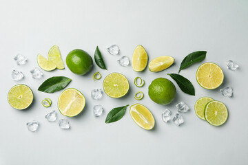 Flat lay with ripe lime on light gray background