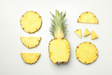Fototapeta na wymiar Flat lay with pineapple and slices on white background