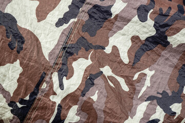 Detail of camouflage fabric pattern background. Stock Photo.