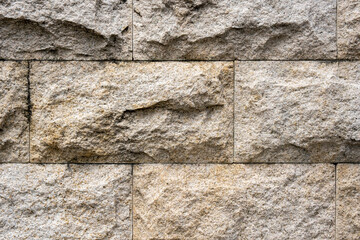 stone wall background in strong sunlight. Stock Photo.