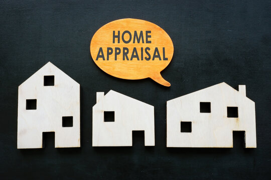 Models of houses and quote home appraisal. Property value concept.