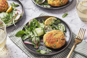 Smoked mackerel fishcakes served with a rocket, spinach salad
