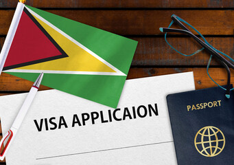 Flag of Guyana, visa application form and passport on table