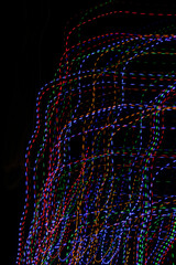 colored lines on a black background.textura