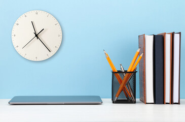 Studio workspace with laptop computer and office supplies