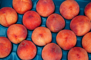 Ripe juicy peaches on the market