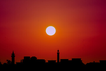 Fototapeta premium Sunset background in river with the mosque in th shadow.