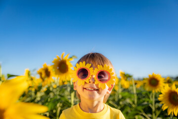 Happy child playing outdoor in spring field