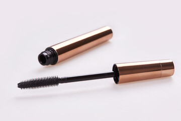 Mascara Bottle with Brush Isolated on White. Golden Colour Bottle.
