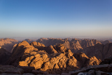 Fototapeta na wymiar Sunrise at mount sinai summit. Road on which pilgrims climb the mountain of Moses. Egypt, Sinai, Mount Moses