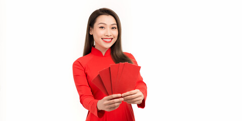 Fototapeta premium Happy girl in Lunar New Year culture hold many red envelopes from her family
