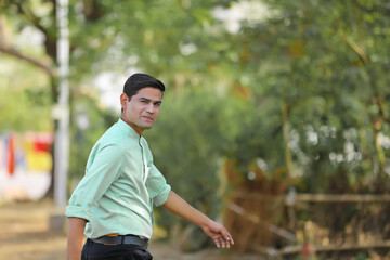 Young handsome indian man giving expression