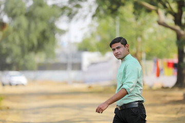 Young handsome indian man giving expression