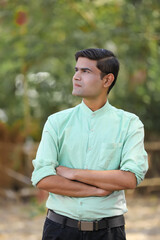 Young handsome indian man giving expression