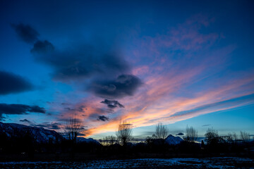 sunset over the city with dramatic clouds