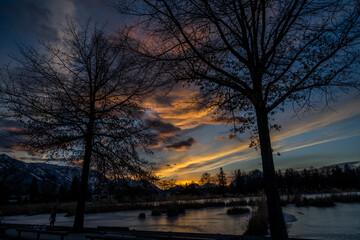 sunset in the city at leopoldskroner weiher in city of salzburg