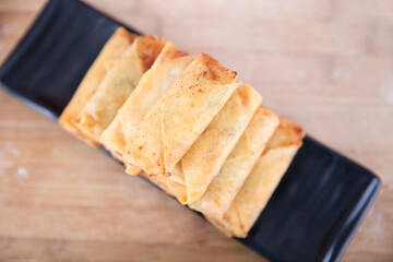 Overlooking a plate of fried spring rolls