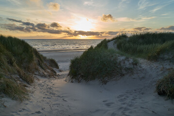 scenic sunset over the dunes of the north sea in Vejers Strand, Denmark