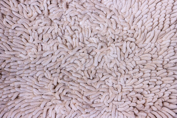 The structure of a soft light carpet with a thick fluffy pile.