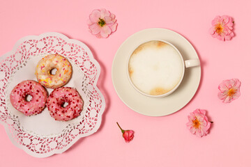 Cup of cappuccino with donuts