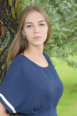 young beautiful woman in blue dress