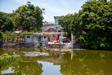 Fototapeta na wymiar A house by the water of Vietnamese peasants,-Cat Ba Island, Vietnam