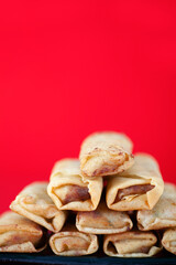 Fried spring rolls, a snack at the beginning of spring in China, on the background with blank vertical composition