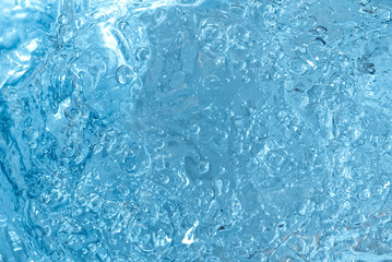 blue transparent clean drinking water abstract background. water surface with air bubbles background