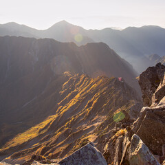 Hutte Ooyari, Japanese mountain hut, in the morning Sunlight. Photo is taken from mt. Yari at dawn. Kamikochi, Northern Alps, Japan