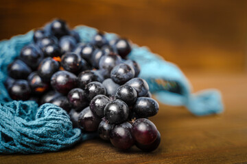 Fresh grapes on a wooden table
