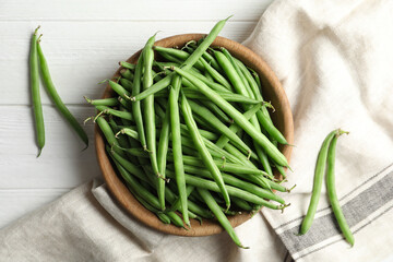 Fresh green beans on white wooden table, flat lay