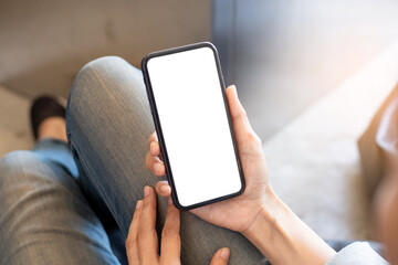 cell phone blank white screen mockup.woman hand holding texting using mobile on desk at office.background empty space for advertise.work people contact marketing business,technology